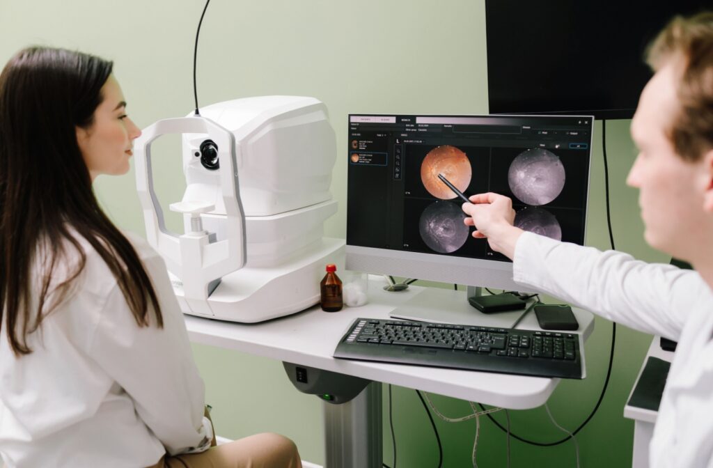 An eye doctor pointing to a scan of a patient's eye, showing the macula.