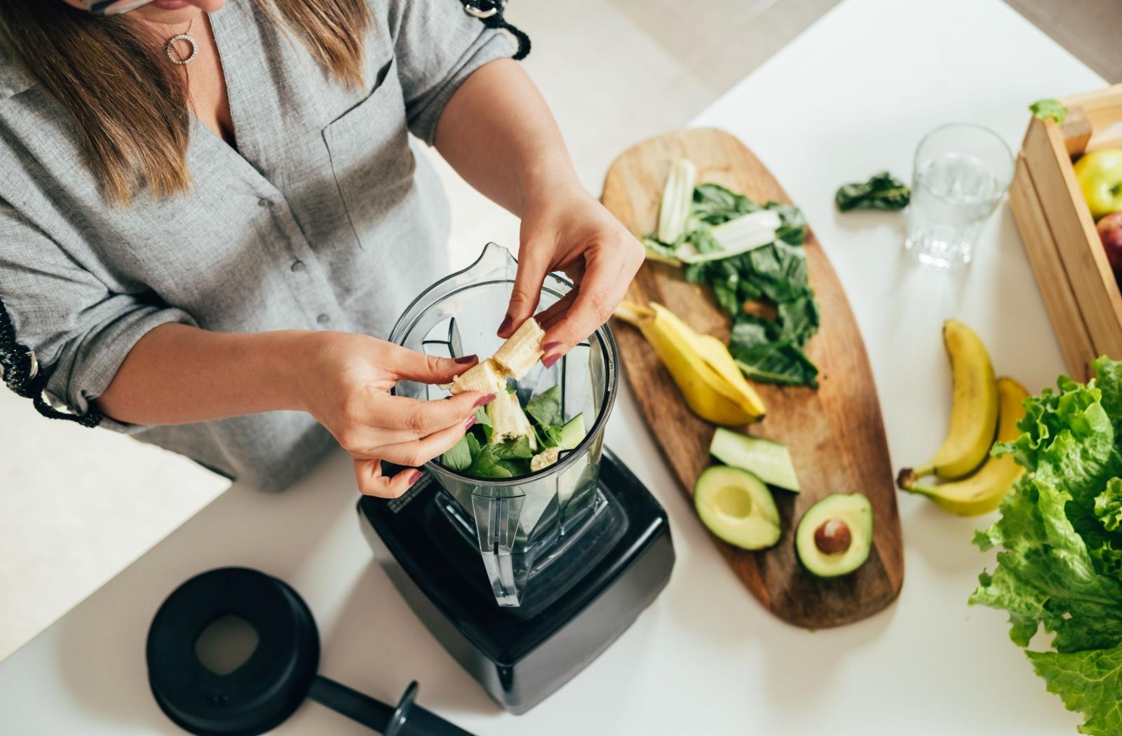 A birds eye view of someone making a healthy smoothie with nutrients good for eye health.